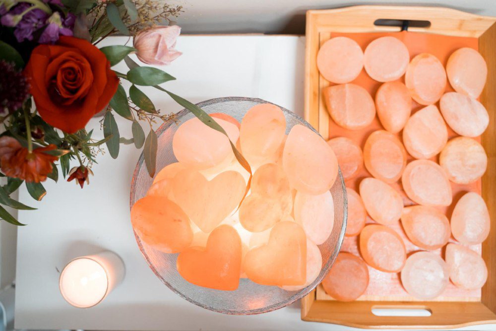 Heart-shaped Himalayan salt stones and flowers prepared at Zen'd Out
